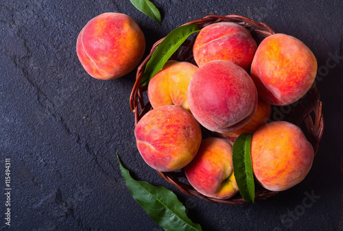 Ripe peaches in basket