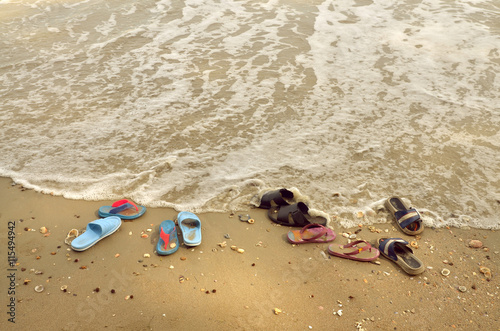 shoes on sand beach in relaxing holiday concept