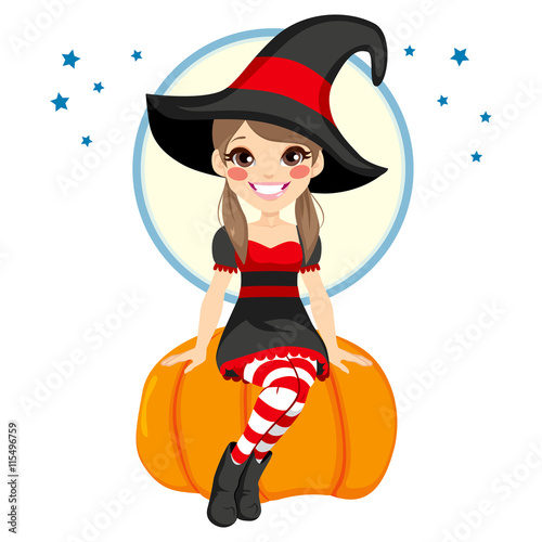 Cute little teenager witch girl sitting on big pumpkin