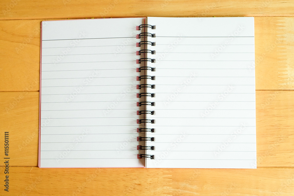 paper notebook on wooden table 