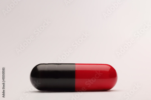 Close-up shot on a red and black pill