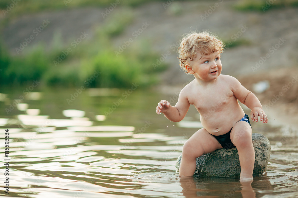 little funny boy playing in water little funny boy playing in water