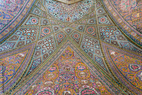 Persian patterns on tiled wall of mosque Nasir ol Molk with traditional artworks, Iran
