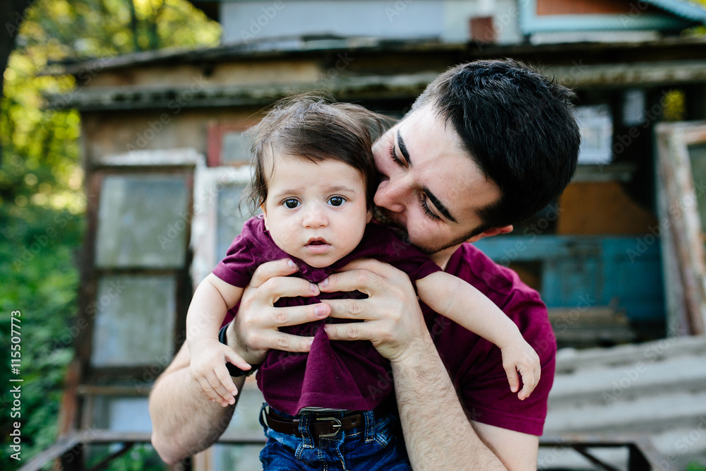 Fototapeta premium young family with a child on the nature
