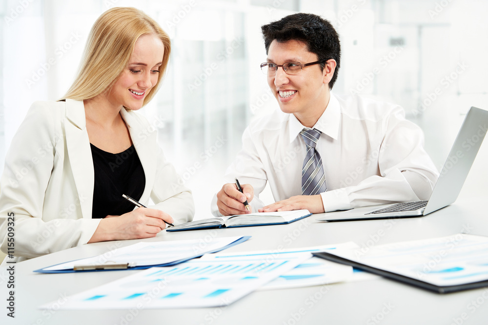 Business partners working at modern office Business partners working at modern office