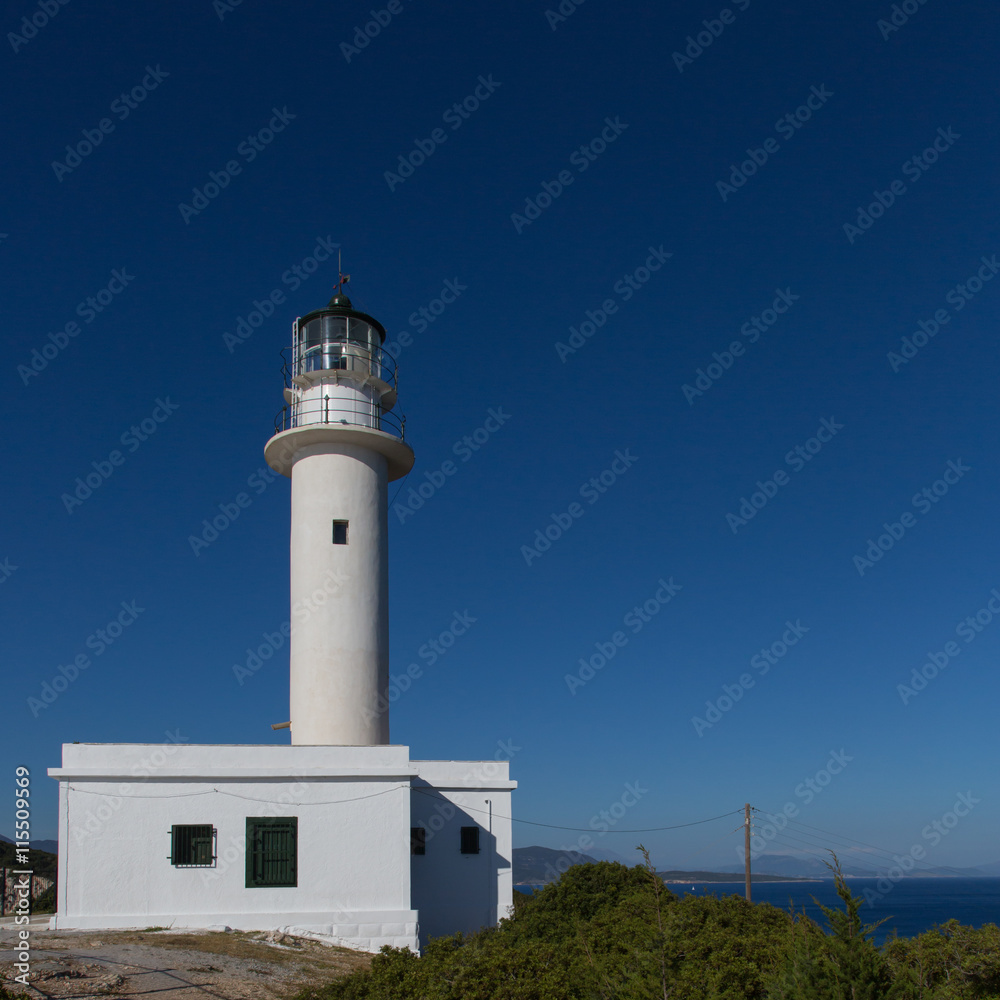 White lighthouse, sea and blue sky