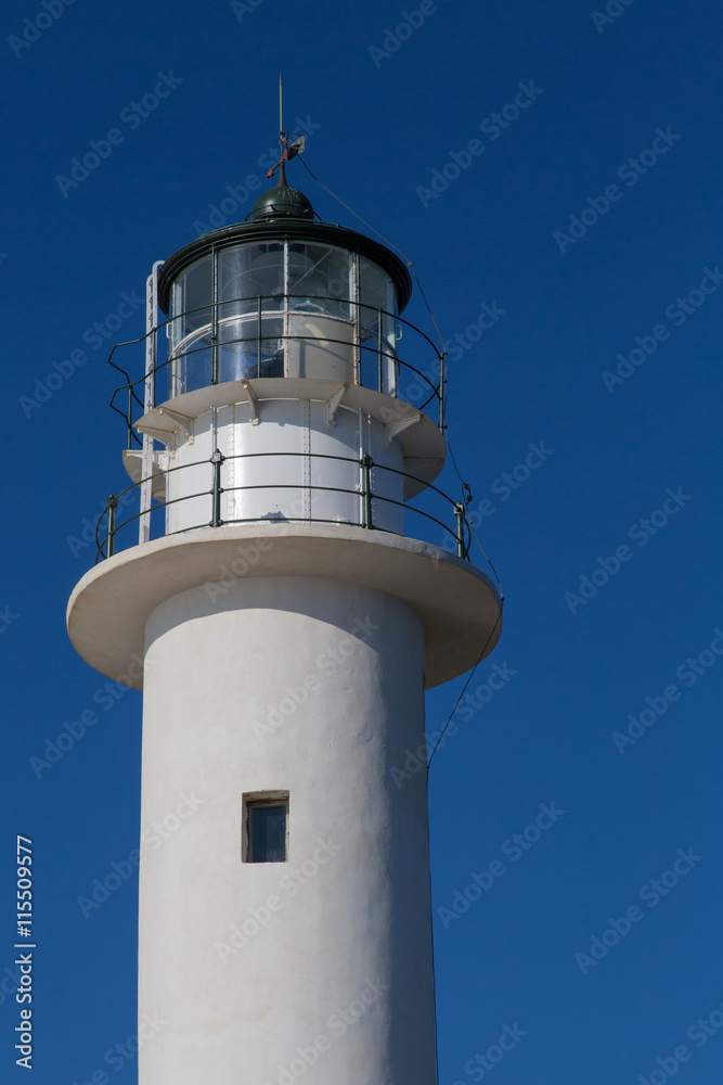 Obraz premium White tower of lighthouse and blue sky