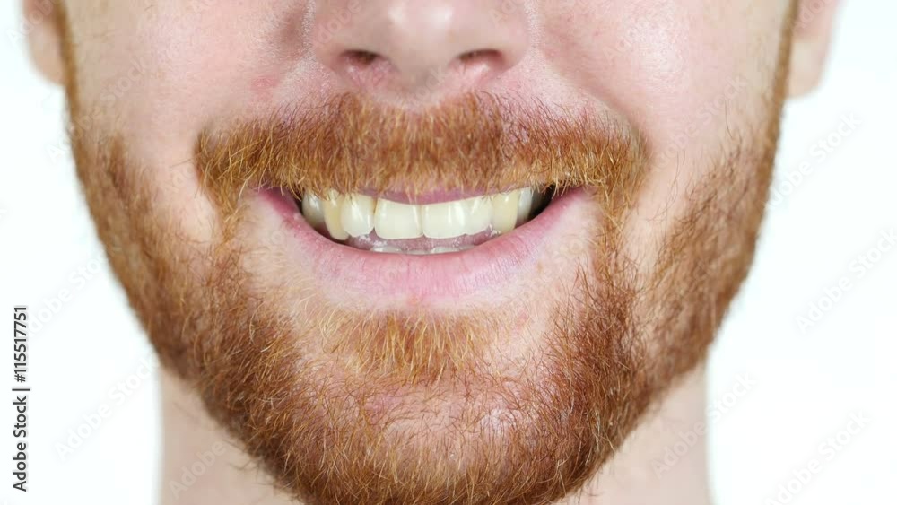 Detailed image of young man smiling with perfect white teeth Detailed image of young man smiling with perfect white teeth