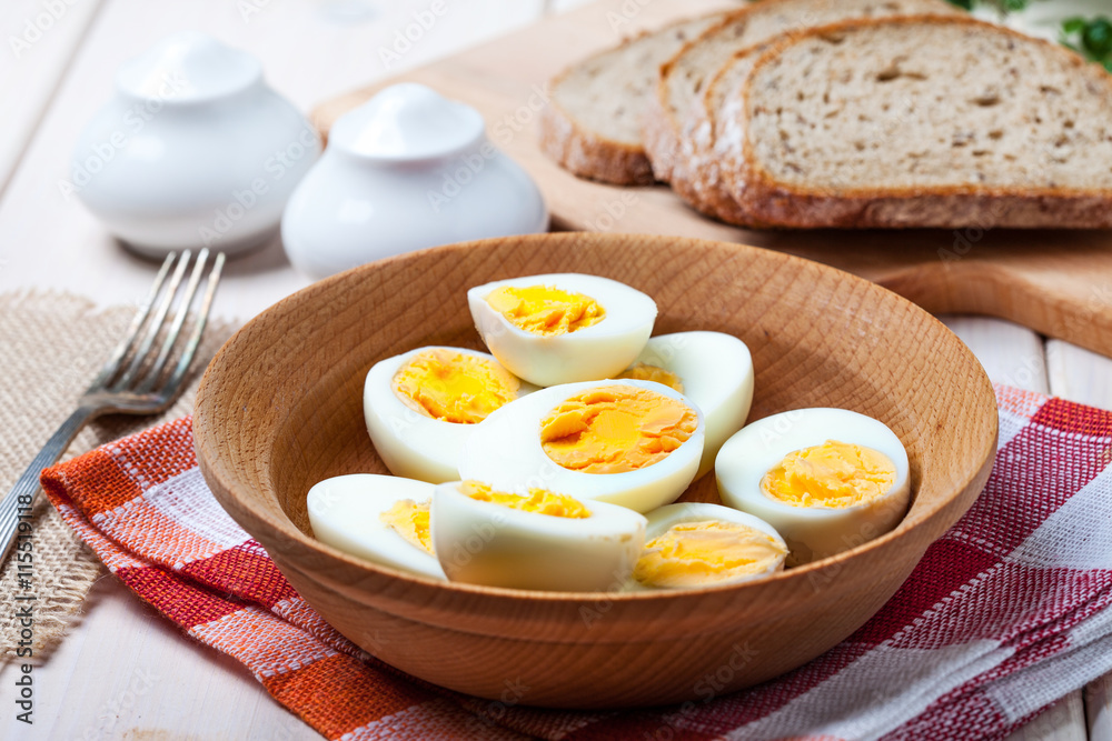 Half-boiled eggs in a wooden bowl. Half-boiled eggs in a wooden bowl.