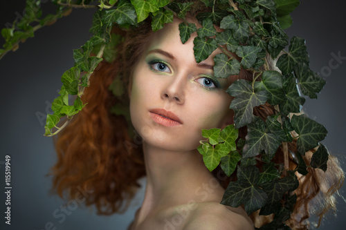 girl wearing a wreath of ivy leaves