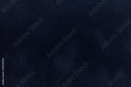Dark blue suede fabric closeup. Velvet texture.