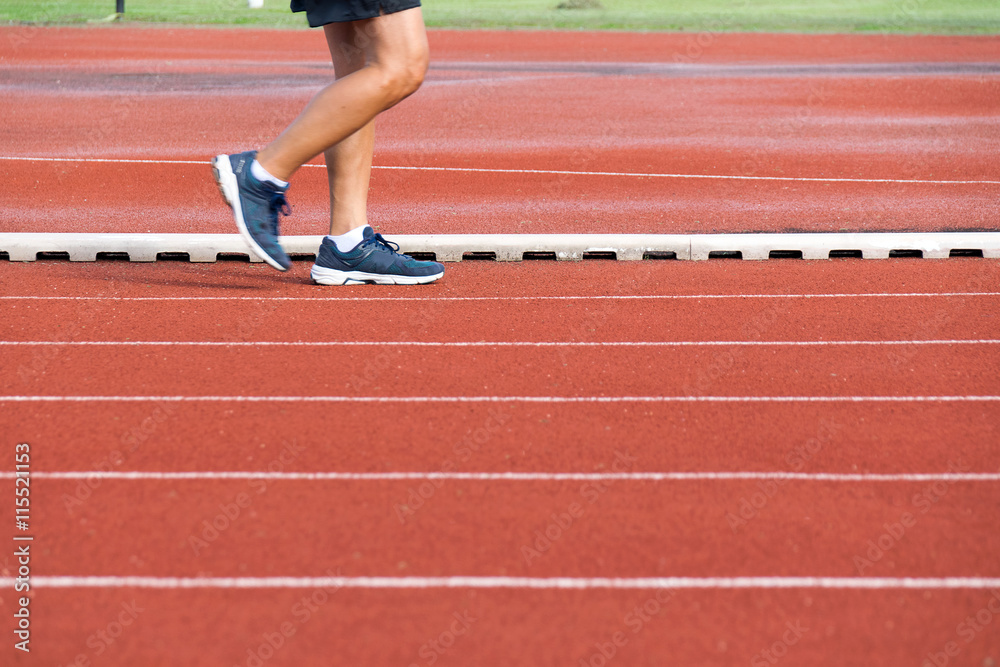 Man walking on track at Sport Stadium