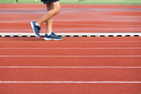 Man walking on track at Sport Stadium