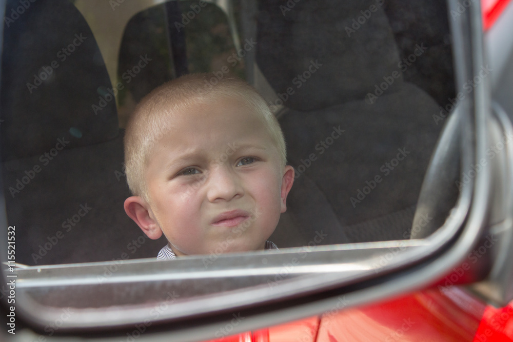 Boy in car mirror Boy in car mirror