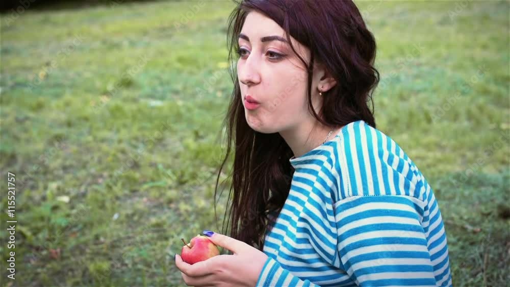 Beautiful girl biting into apple Beautiful girl biting into apple