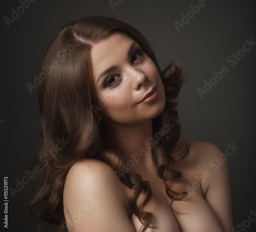 Beauty portrait of a young beautiful brunette girl with long black  hair