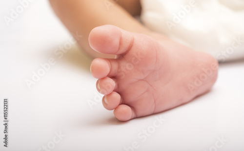 New Born baby adorable feet close up.