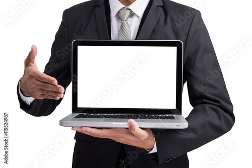 Yong businessman holding laptop computer showing screen display