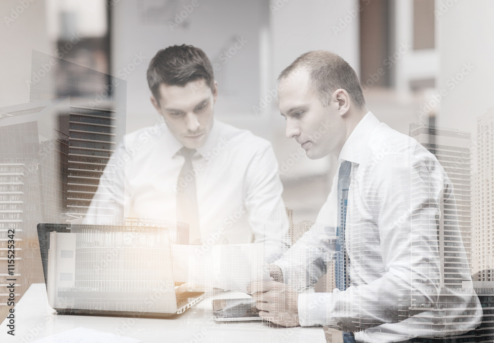 two businessmen having discussion in office two businessmen having discussion in office