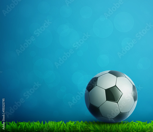 Soccer ball flying in air with grass. Football background.