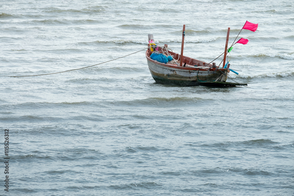 Fototapeta premium Fisherman Boat on beach at sunset time