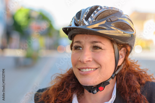 Attractive young woman wearing a safety helmet