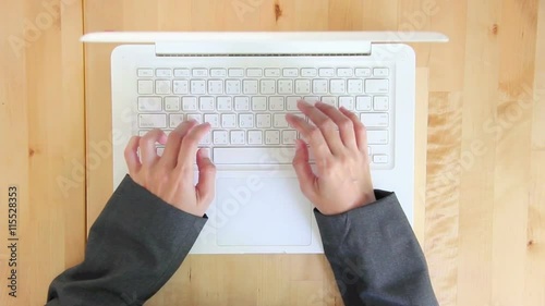 Top View Woman Hands Typing On Laptop Keyboard.