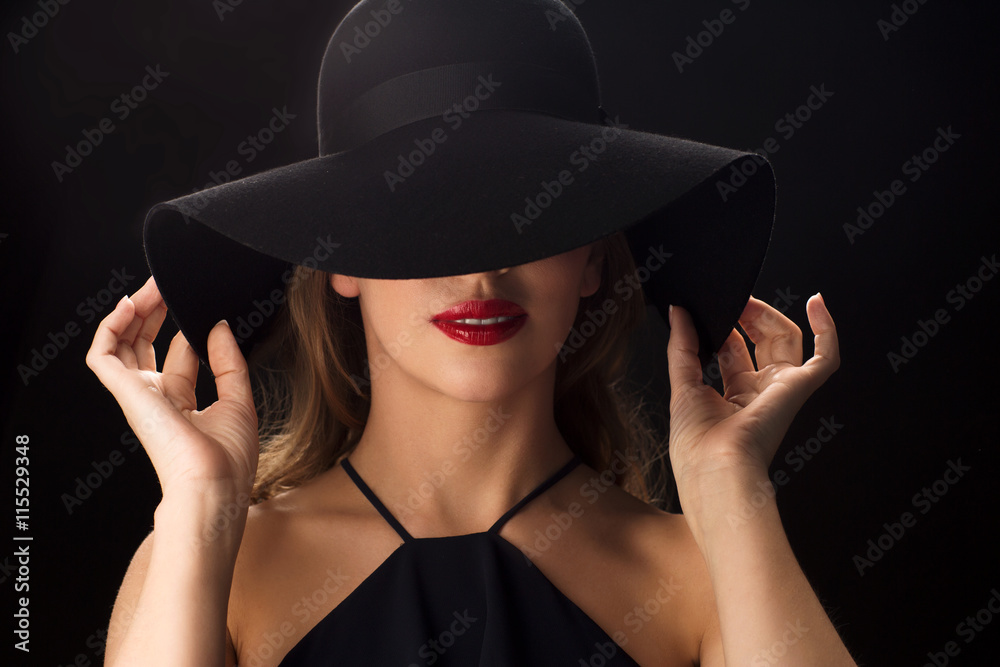 beautiful woman in black hat over dark background beautiful woman in black hat over dark background