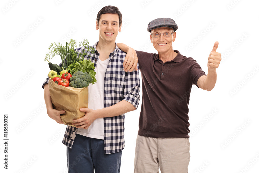 Guy helping a senior man with groceries Guy helping a senior man with groceries