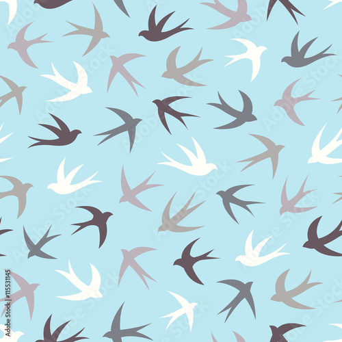 Seamless pattern with a flock of swallows. Vintage background of silhouettes of birds in the sky. Vector illustration.