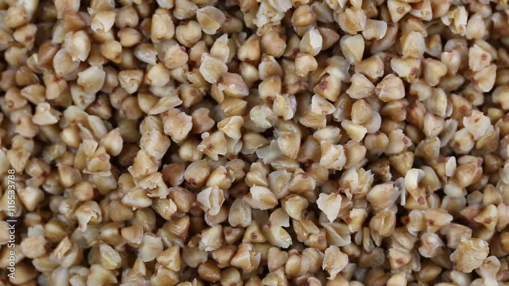 Boiled buckwheat porridge close up. Loop rotation. Front of the camera rotates plate with buckwheat Boiled buckwheat porridge close up. Loop rotation. Front of the camera rotates plate with buckwheat