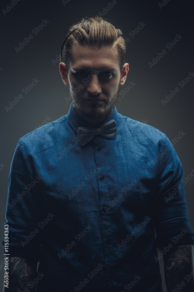 Portrait of modern male in blue shirt.