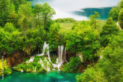 Plitvice Lakes National Park amazing emerald lakes and waterfalls  surrounded by forests in Croatia  nature background suitable for wallpaper or guide book