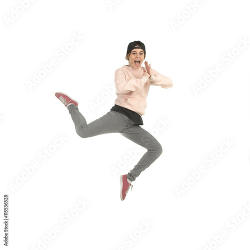 young blonde woman in studio jumping