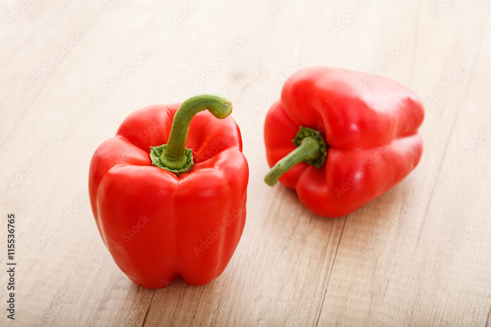 Peppers on a wooden surface Peppers on a wooden surface