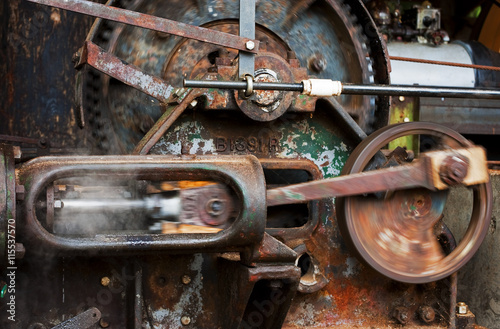 Steam Engine. A closeup view of an operational antique steam engine.