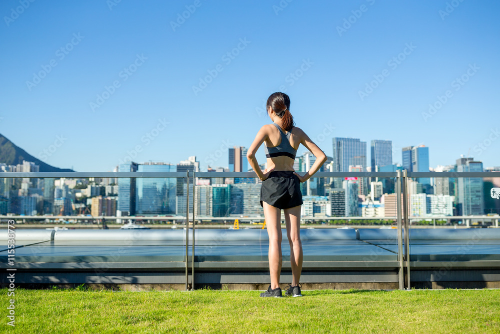 Sporty woman standing in the city