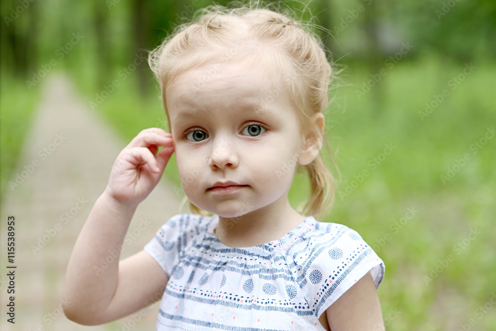 Portrait of a little girl on the road in park Portrait of a little girl on the road in park