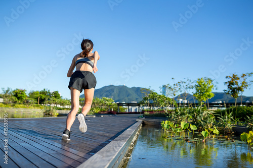 Woman running in outdoor park