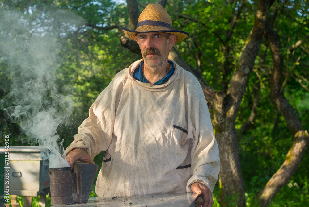 Portrait of Ukrainian bee-keeper at work place Portrait of Ukrainian bee-keeper at work place