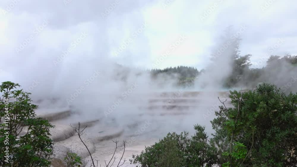 White smoke and steam rising from geothermal hot water terraces White smoke and steam rising from geothermal hot water terraces
