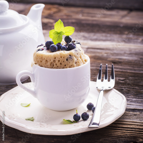 Blueberry Microwave Muffin in mug . Selective focus