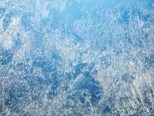 Ice crystals on the surface of the window.