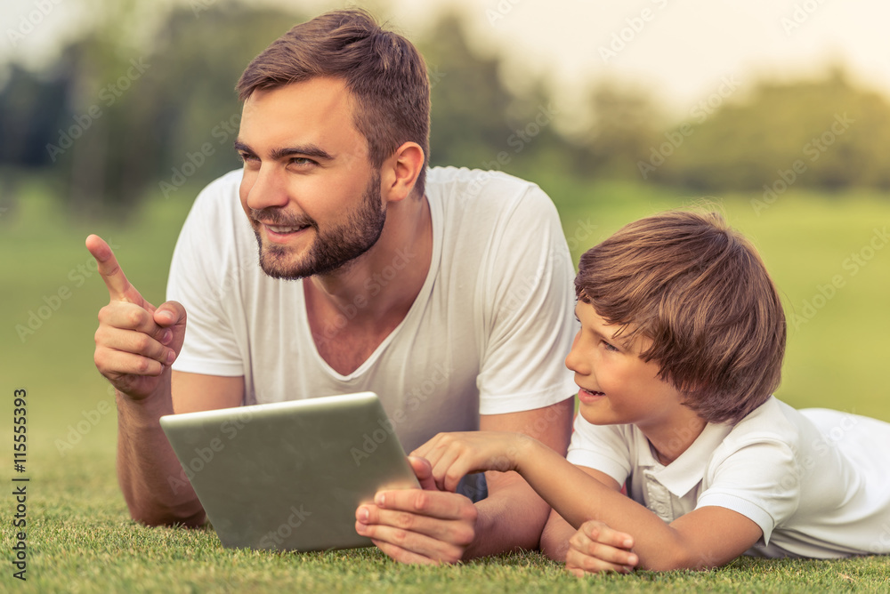 Dad and son with gadget Dad and son with gadget