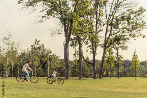 Dad and son cycling