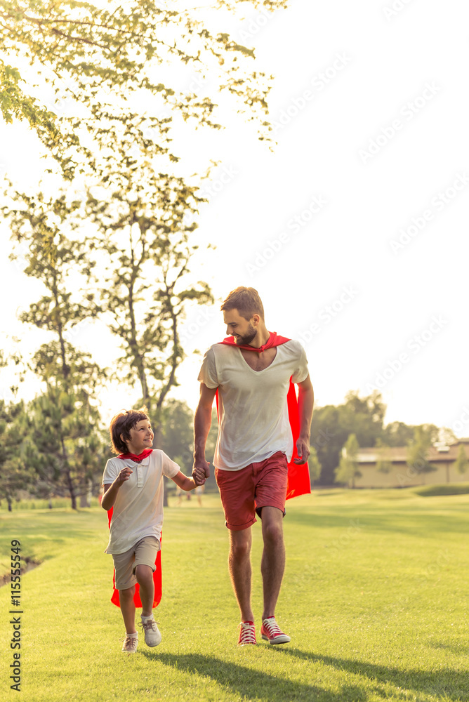 Fototapeta premium Dad and son playing superheroes