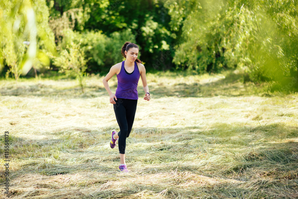 Active attractive running young woman outdoor. Workout in the park, forest, nature. Sport Active attractive running young woman outdoor. Workout in the park, forest, nature. Sport