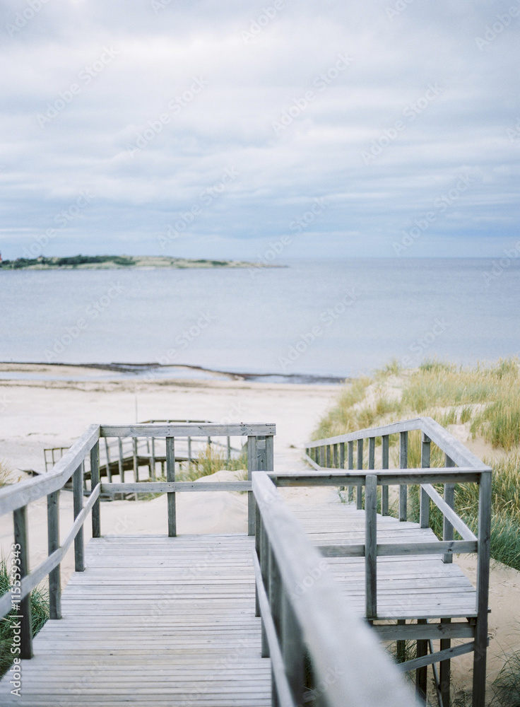 Sweden, Halmstad, Tylosand, Wooden steps leading to sandy beach Sweden, Halmstad, Tylosand, Wooden steps leading to sandy beach