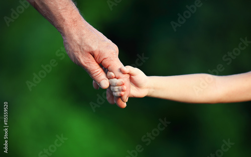 concept of family. Hand the child's in hand father