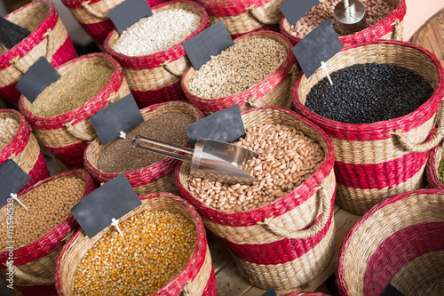 Assortment of dry beans packed in baskets on bazar